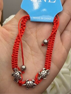 Red Braided Bracelet with Silver Turtle Charms